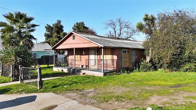 exterior space with fence and covered porch