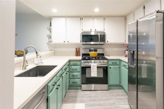 24837 Apple St Unit B, Newhall, CA 91321 - kitchen featuring appliances with stainless steel finishes, light wood-type flooring, white cabinets, light countertops, and recessed lighting