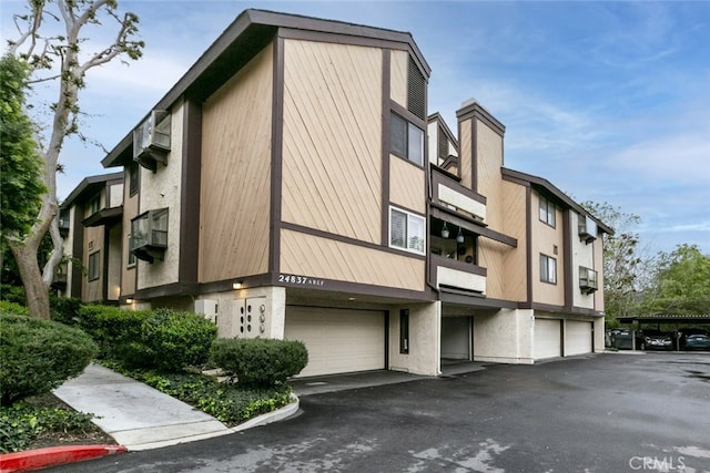 view of building exterior with an attached garage