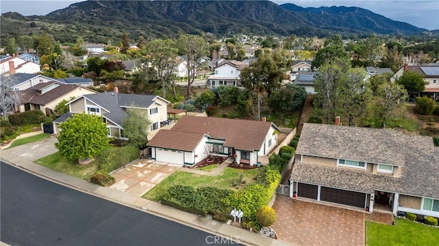 drone / aerial view with a residential view and a mountain view