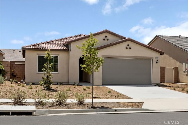19781 Lurin Ave, Riverside, CA 92508 - mediterranean / spanish-style home featuring a garage, stucco siding, driveway, and a tiled roof