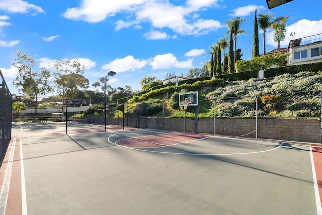 view of sport court with community basketball court and fence