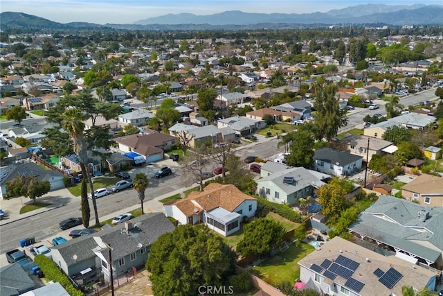 birds eye view of property with a mountain view and a residential view