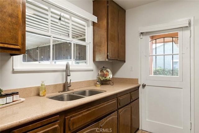 kitchen with a sink and light countertops