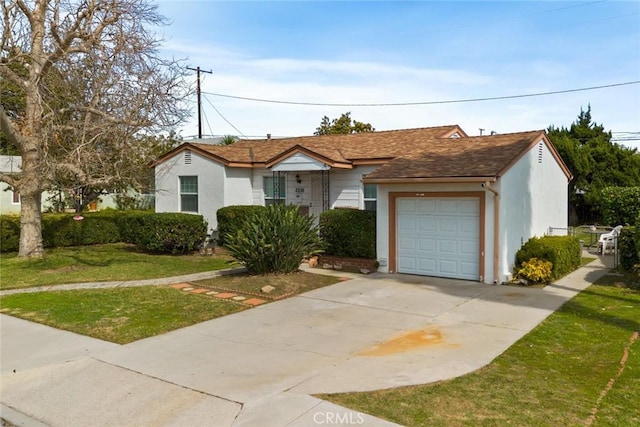 single story home featuring stucco siding, driveway, a front yard, and a garage