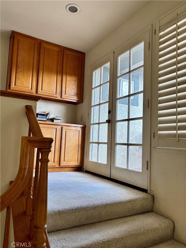 interior space featuring carpet flooring and french doors