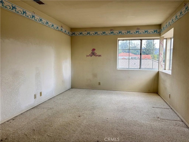 empty room featuring carpet flooring