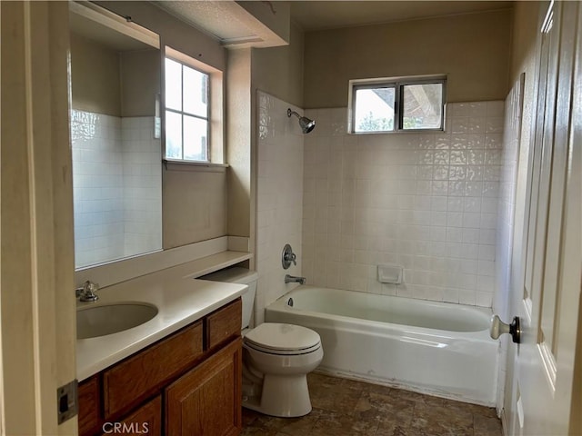 bathroom featuring tub / shower combination, toilet, and vanity