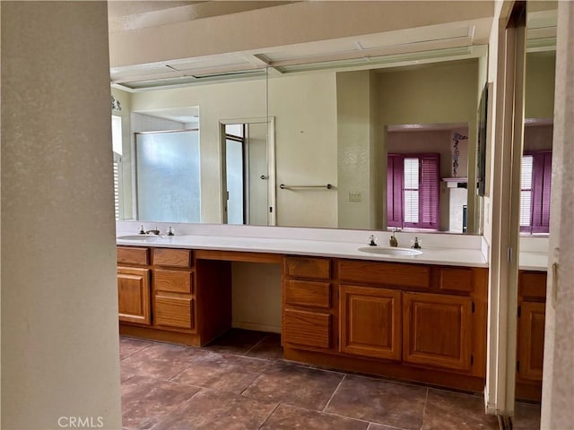 full bathroom with double vanity and a sink