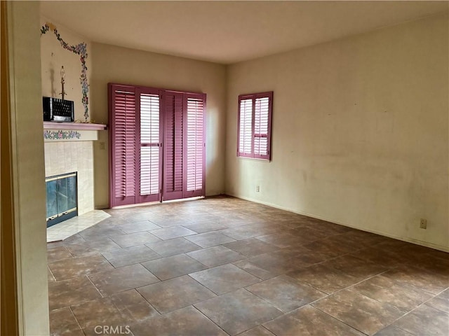 unfurnished living room with a fireplace