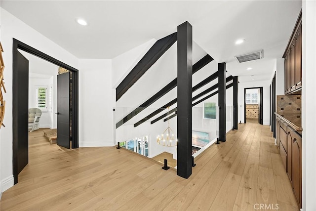 interior space with recessed lighting, visible vents, baseboards, and light wood finished floors