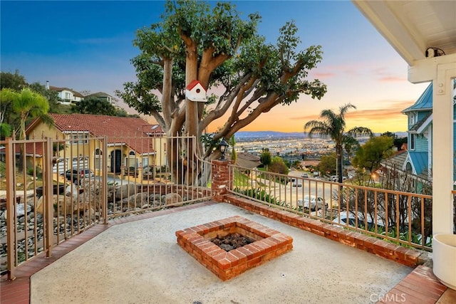 view of patio / terrace featuring an outdoor fire pit