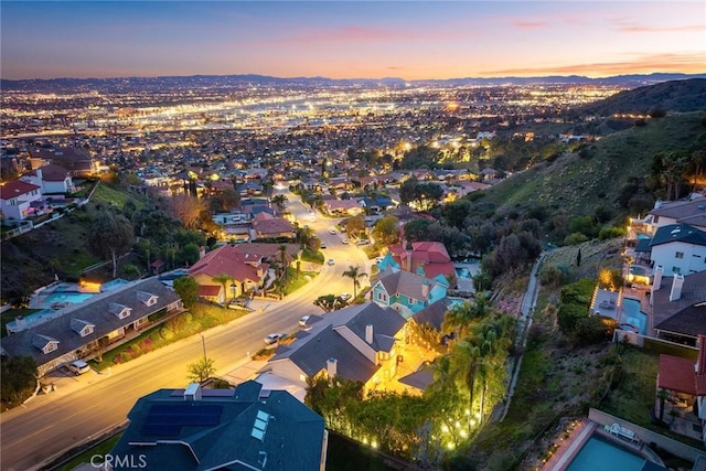 aerial view at dusk with a residential view