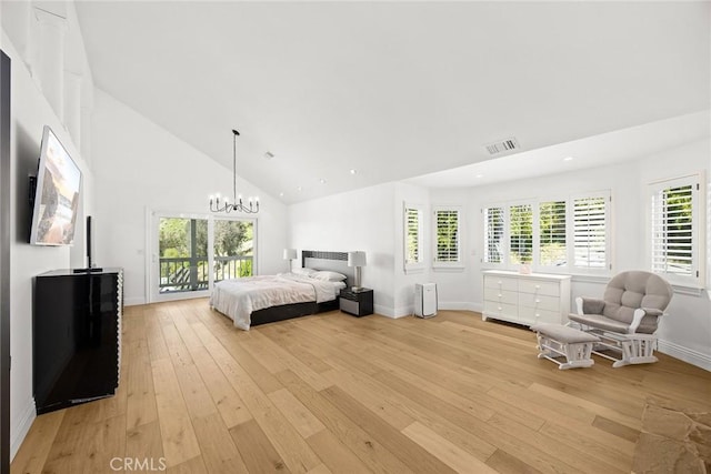 bedroom featuring access to outside, visible vents, light wood finished floors, and high vaulted ceiling