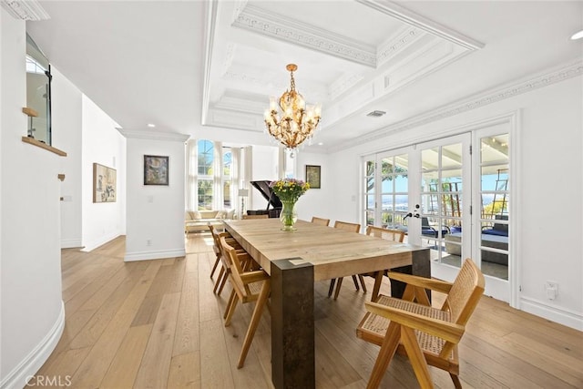 dining room with light wood-type flooring, ornamental molding, coffered ceiling, french doors, and baseboards