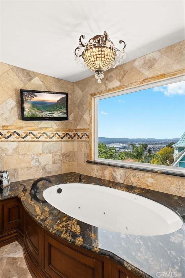 full bathroom featuring a jetted tub