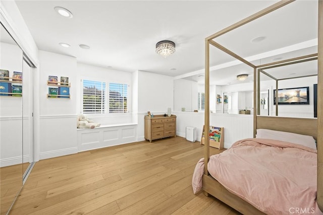 bedroom with recessed lighting and light wood-type flooring