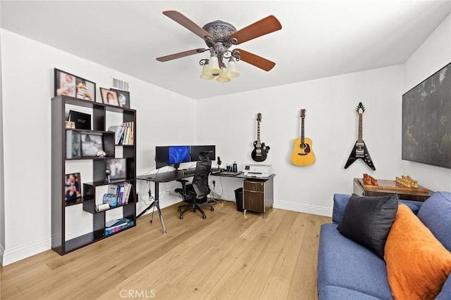 home office with wood finished floors, baseboards, and ceiling fan