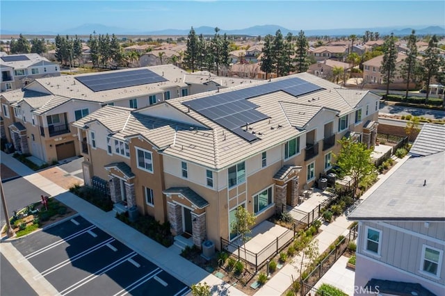 drone / aerial view with a mountain view and a residential view