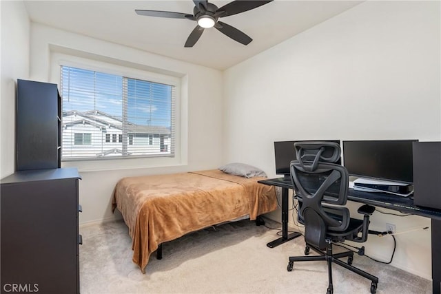 bedroom featuring baseboards, light carpet, and ceiling fan