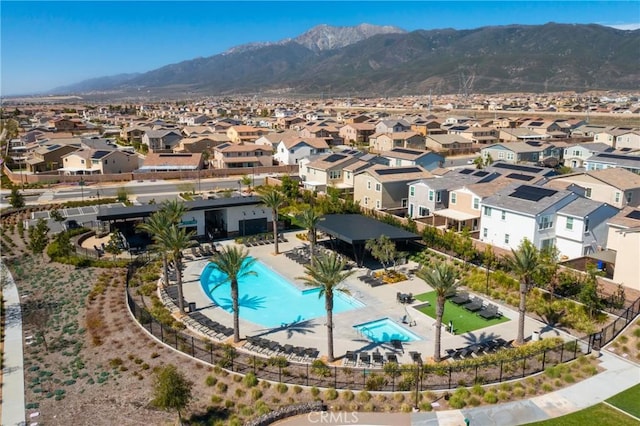 birds eye view of property with a mountain view and a residential view