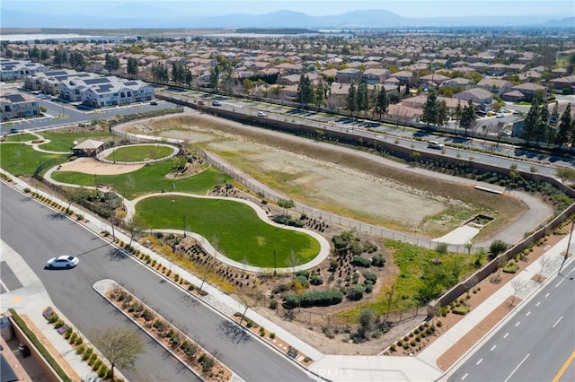 birds eye view of property featuring a mountain view and a residential view