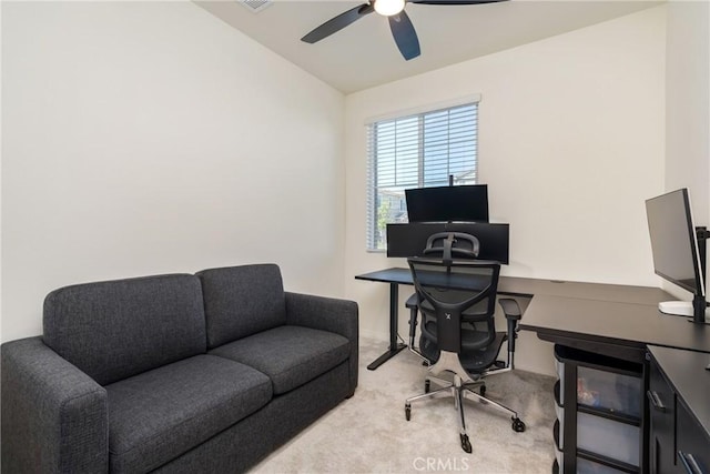 office space featuring light carpet, visible vents, lofted ceiling, and ceiling fan