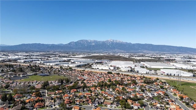 birds eye view of property with a mountain view