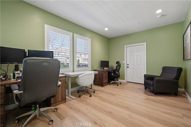 office featuring recessed lighting, baseboards, and light wood finished floors