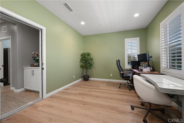 office area featuring recessed lighting, visible vents, baseboards, and light wood-style floors