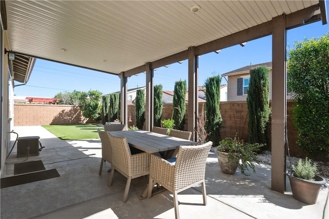 view of patio / terrace with outdoor dining space and a fenced backyard