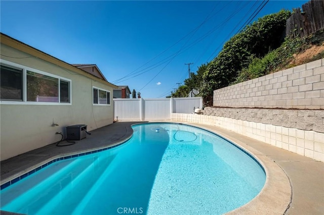 view of pool with a patio area, a fenced backyard, and a fenced in pool