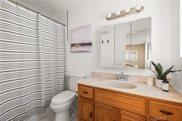 bathroom with toilet, vanity, and a shower with curtain