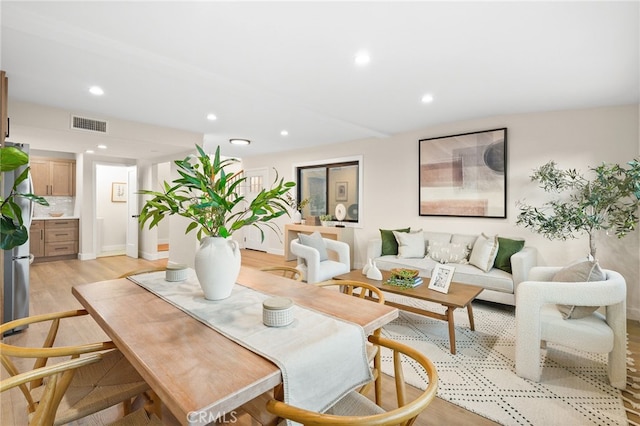 dining area with recessed lighting, light wood-style floors, and visible vents