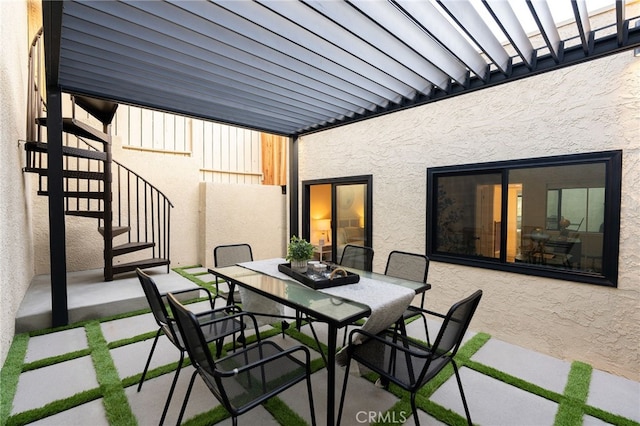 view of patio / terrace with stairs and outdoor dining area