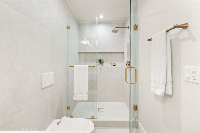 bathroom featuring a shower stall and toilet