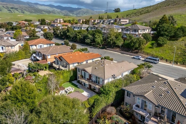 drone / aerial view with a residential view and a mountain view