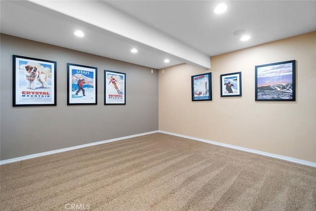 carpeted empty room featuring recessed lighting, beamed ceiling, and baseboards