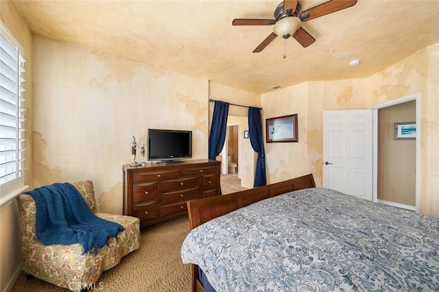 bedroom with carpet flooring, a ceiling fan, and baseboards