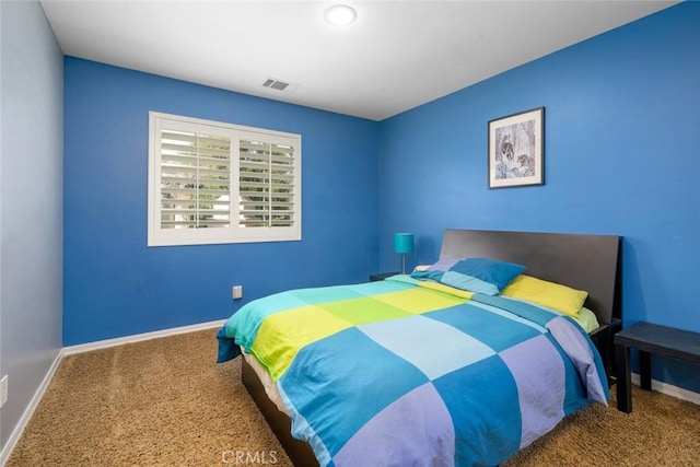 bedroom with visible vents, baseboards, and carpet