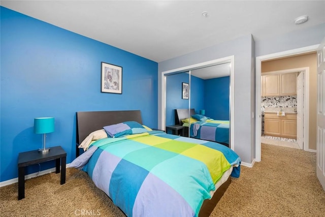 bedroom with a closet, baseboards, and carpet flooring