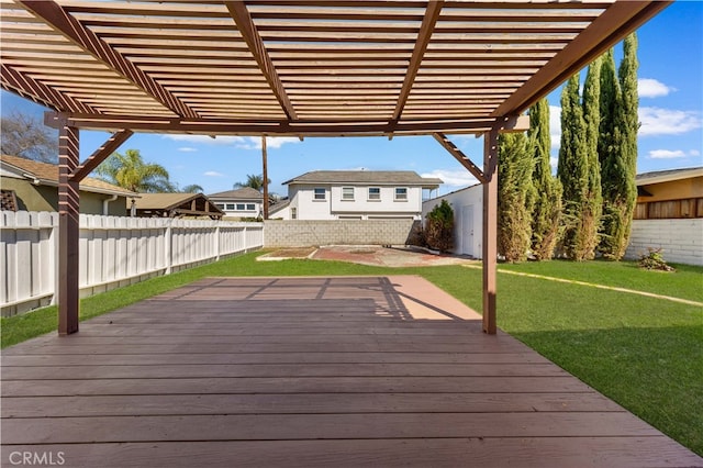 wooden deck featuring a lawn, a pergola, and a fenced backyard