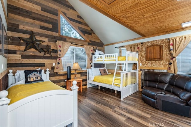 bedroom featuring wood ceiling, wooden walls, wood finished floors, and high vaulted ceiling