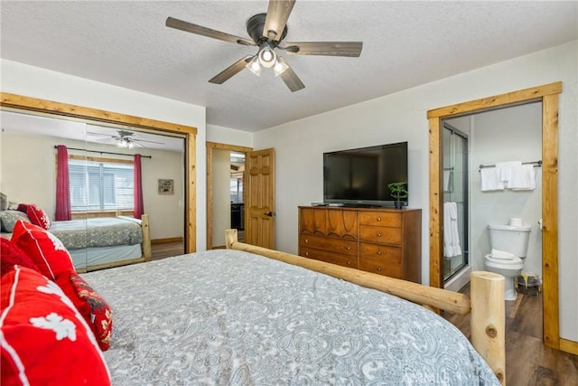 bedroom featuring a textured ceiling, a ceiling fan, and wood finished floors