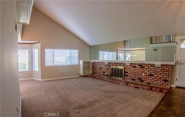 unfurnished living room with baseboards, high vaulted ceiling, a fireplace, and carpet