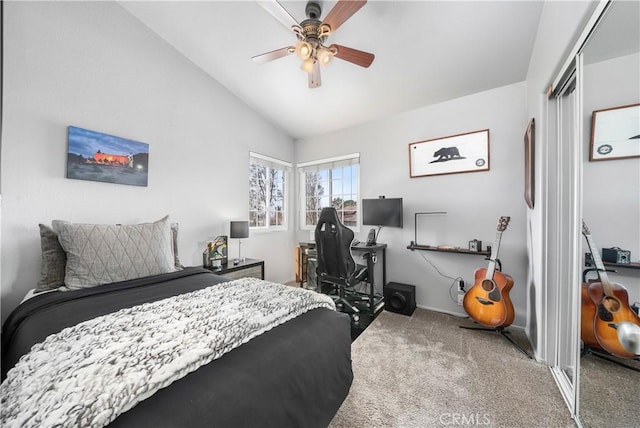 bedroom featuring a closet, a ceiling fan, lofted ceiling, and carpet floors