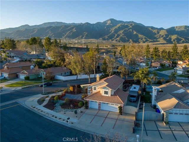 drone / aerial view featuring a mountain view and a residential view