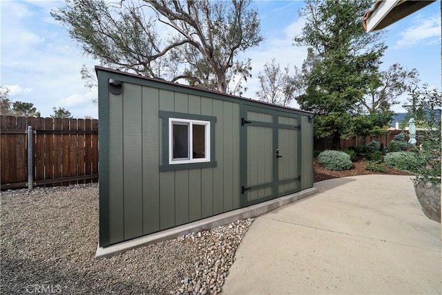 view of shed featuring a fenced backyard