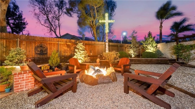 view of patio featuring a fire pit and a fenced backyard