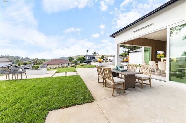 view of patio / terrace with a residential view and outdoor dining area